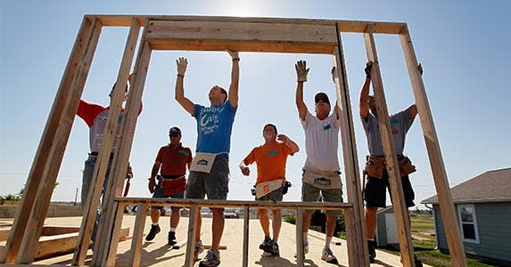 A group of people building a house