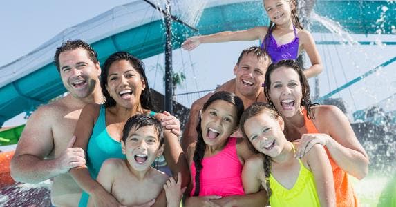 Two families together at water park © iStock