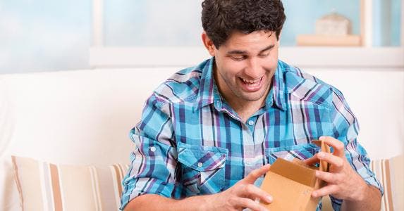Man excited over package's arrival © iStock