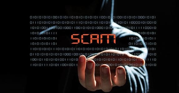 How to defend yourself against con artists Hacker with scam text icon | iStock.com/gong hangxu