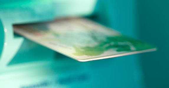 The ATM card has some competition ATM card sticking out from machine slot | Derek E. Rothchild/Getty Images
