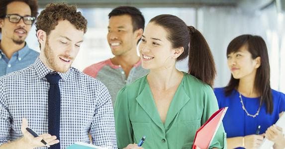 Economists: Stocks too hot, economy warming up nicely Coworkers walking down hallway | Caiaimage/Paul Bradbury/Getty Images