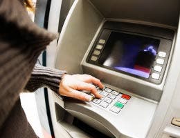 Woman using the ATM