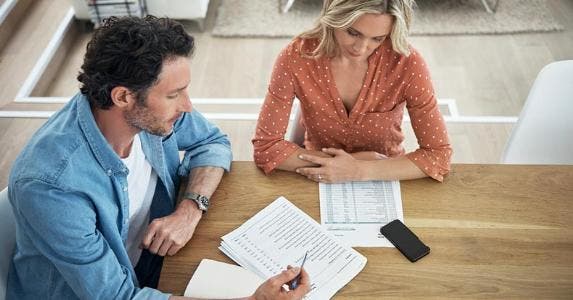How 30-somethings can protect against ID theft Husband and wife working together on budget © iStock