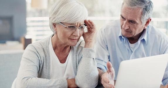 How to avoid ID theft in your 60s and beyond Senior couple stressed, concerned over bills © iStock