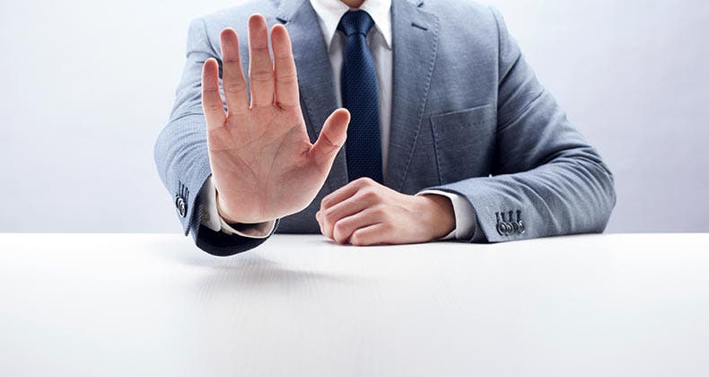 Want FHA loan? Beware this blacklist Businessman gesturing stop © iStock
