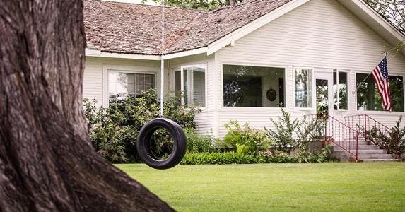 Cash-out refinance: When is it a good choice? Tire swing in front of home | Hill Street Studios/Getty Images