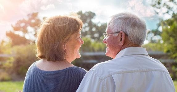 Expensive surprise with reverse mortgage Senior couple smiling at each other © Phase4Studios/Shutterstock.com