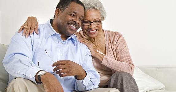 Couple seated, laughing together © bikeriderlondon/Shutterstock.com
