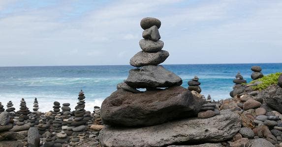 Building a CD ladder can elevate your returns Rocks balancing on each other on the beach | Andreas Naumann / EyeEm/Getty Images