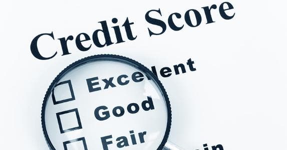How your credit score affects your mortgage rate Magnifying glass on levels of credit scores © Feng Yu/Shutterstock.com