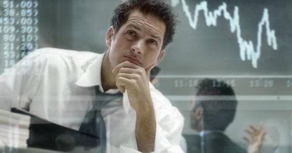 Investor analysing stock trends © iSTock