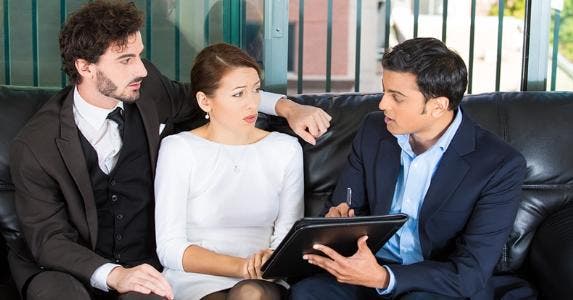 Sitting with adviser on black couch © PathDoc/Shutterstock.com