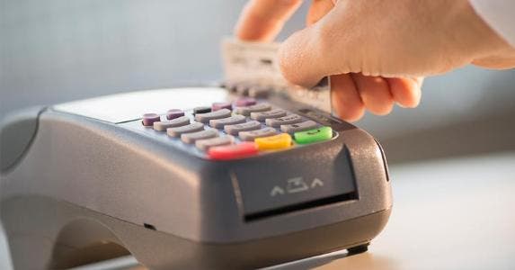 Why you're still swiping your credit card Swiping card through chip reader | Tetra Images/Getty Images