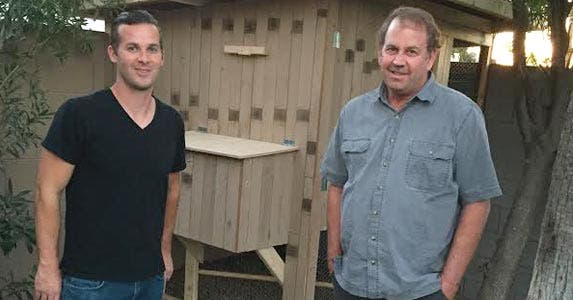 Brett Farmiloe (left) and his Uncle Mike, in front of the henhouse they built in Brett's backyard. Photo courtesy of Brett Farmiloe