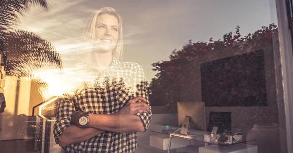 As hiring increases, so does our financial security Woman smiling, looking out of the window | Corey Jenkins/Image Source/Getty Images