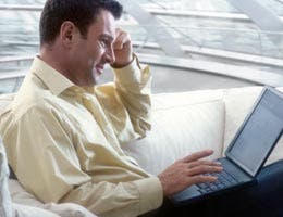 Middle-aged man using a laptop computer