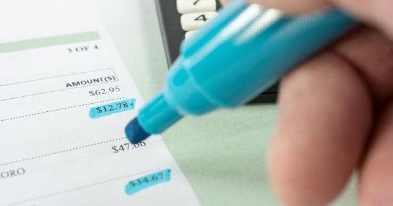 Highlighting a dollar amount on paper © iStock