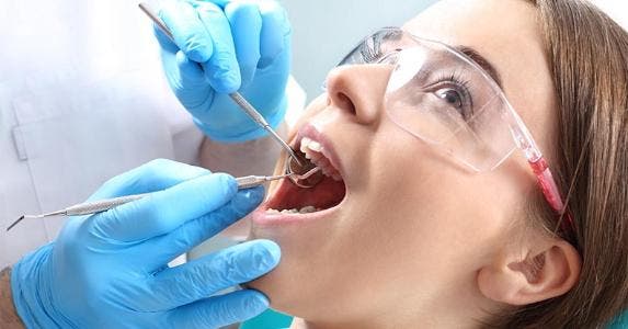 How much does a root canal cost? Patient at dentist's office © Robert Przybysz/Shutterstock.com