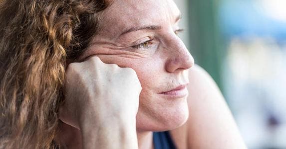 Is wife liable for deceased husband's debt? Close up shot of pensive mature woman | Juanmonino/E+/Getty Images