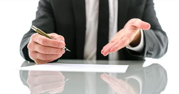 Private mortgage insurance, or PMI: The basics Businessman gesturing to contract | iStock.com