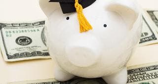 Piggy bank wearing graduation cap © karen roach/Shutterstock.com
