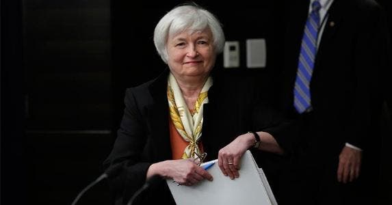 A Fed rate hike? Economists play guessing game Smiling Janet Yellen holding folder | Yuri Gripas/Getty Images