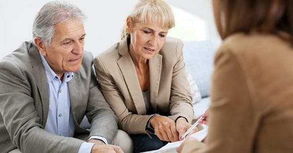 Senior couple with adviser © Goodluz/Shutterstock.com