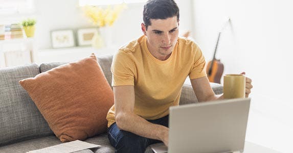 Tapping a personal loan online Tapping a personal loan online | Tetra Images/Getty Images