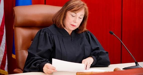 3 fabulous jobs you can have for life Senior female judge reading paperwork | iStock.com/Alina Solovyova-Vincent