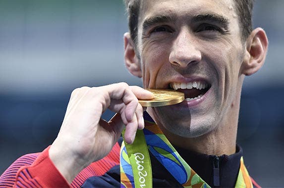 Medal biter Medal biter | GABRIEL BOUYS/Getty Images