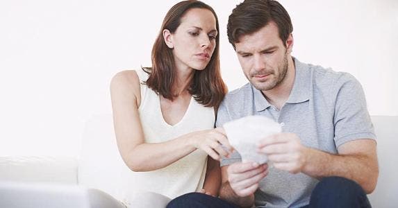 Couple looking over receipts together © iStock