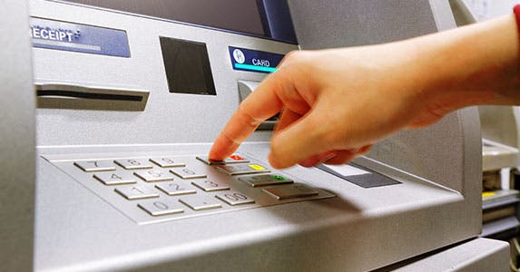 Check for ATM reimbursement © cozyta/Shutterstock.com
