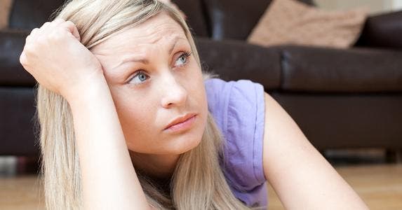 Bored, sad woman in living room © wavebreakmedia/Shutterstock.com
