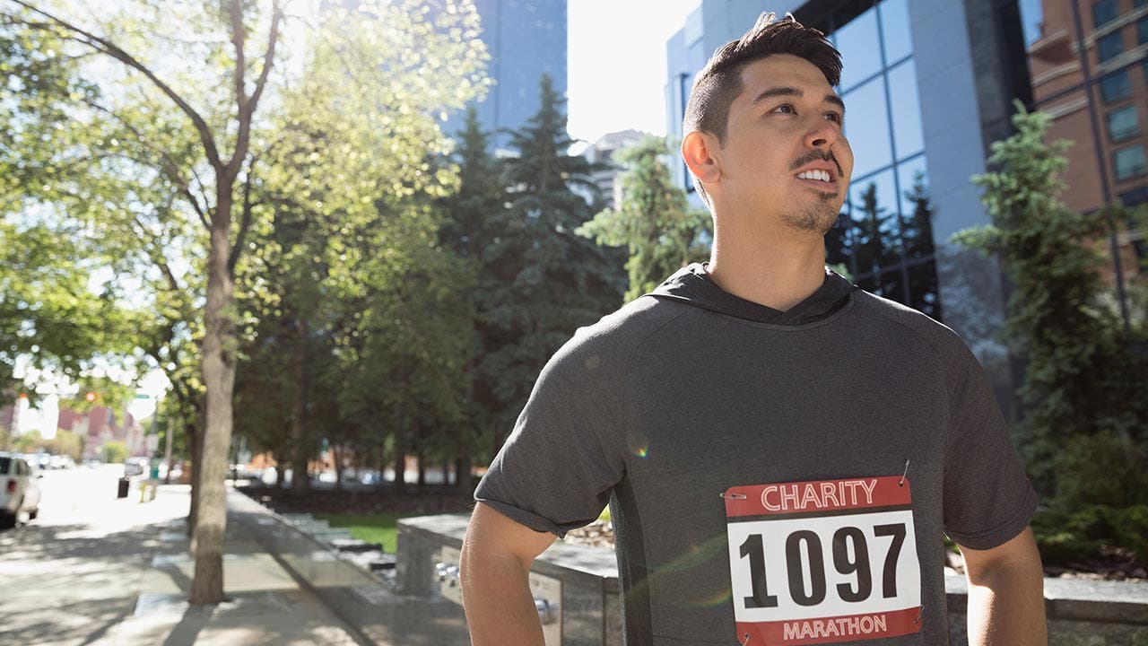 Man excited to start running a marathon