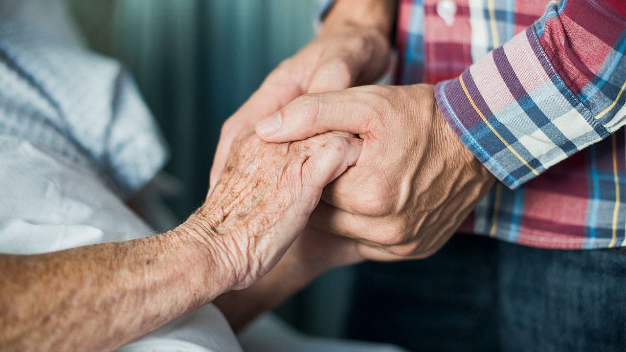 Adult child and elderly parent