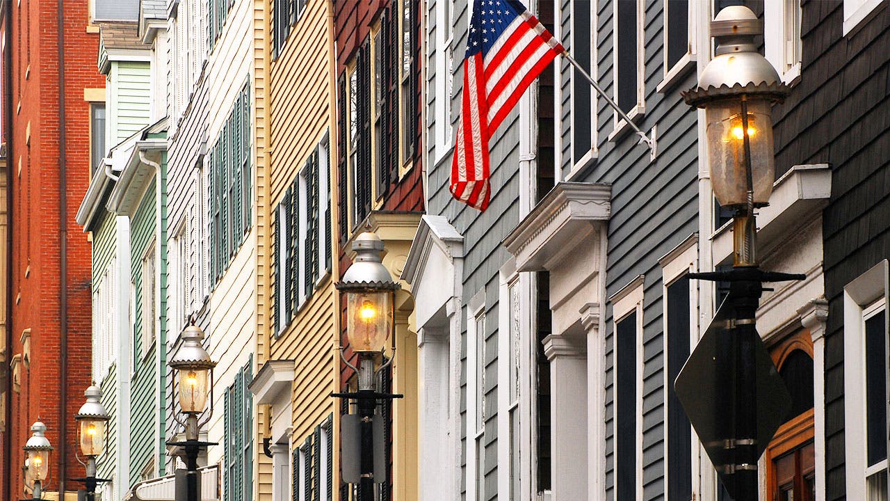 Row of townhouses with an American flag