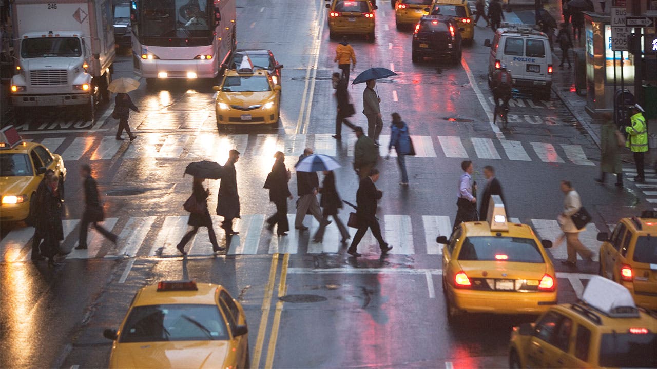 Pedestrians walking across the street in New York
