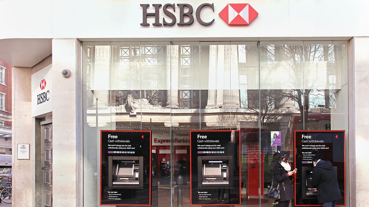 Couple at atm at a HSBC bank branch