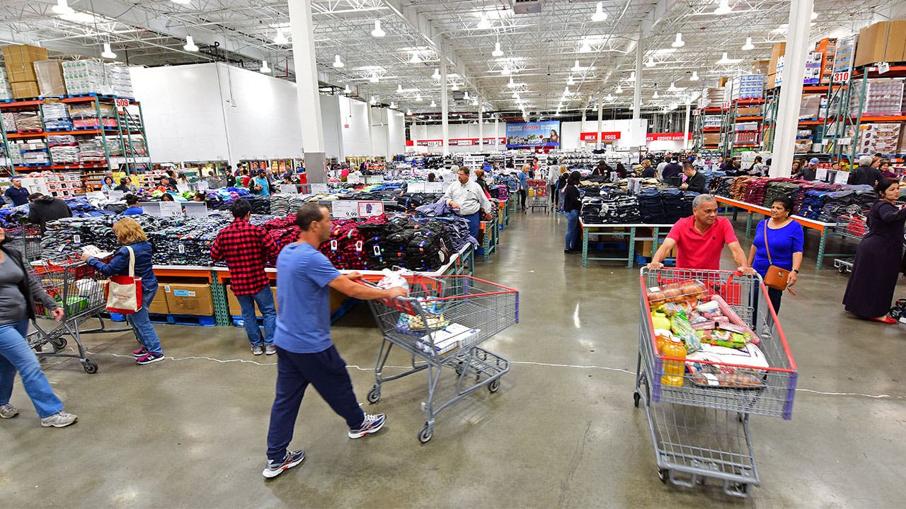 People walking in Costco aisle
