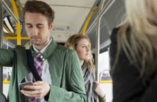Commuters standing on bus