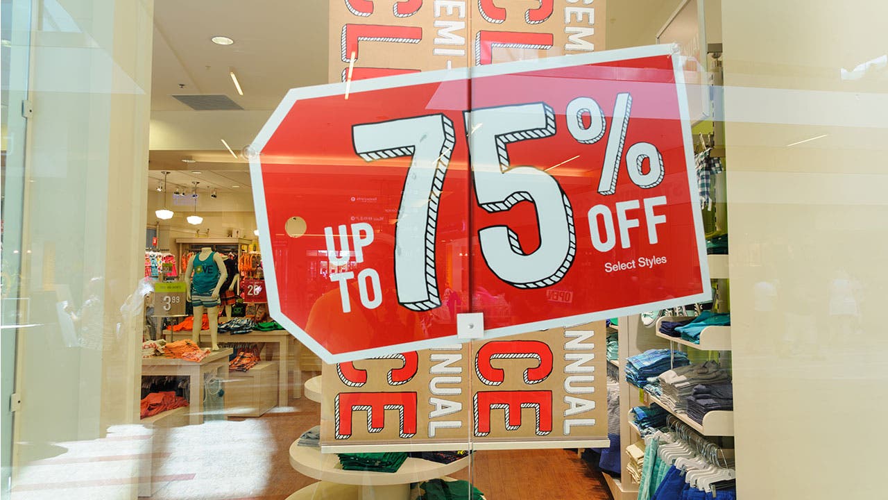 Clearance sale signs in store window