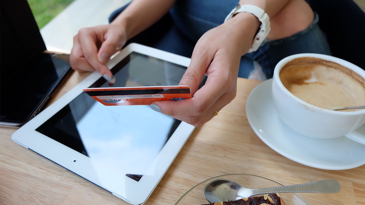 Woman making a purchase on tablet