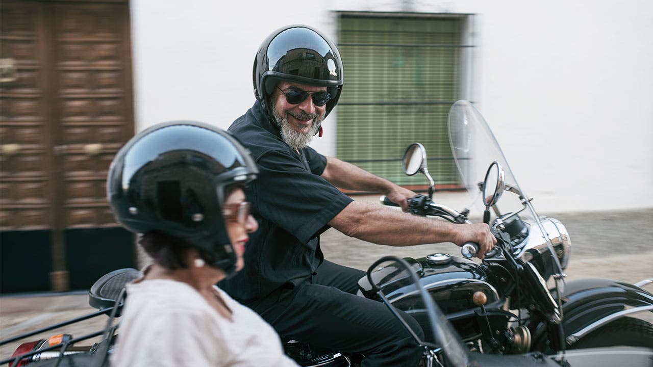 Older couple on motorcycle