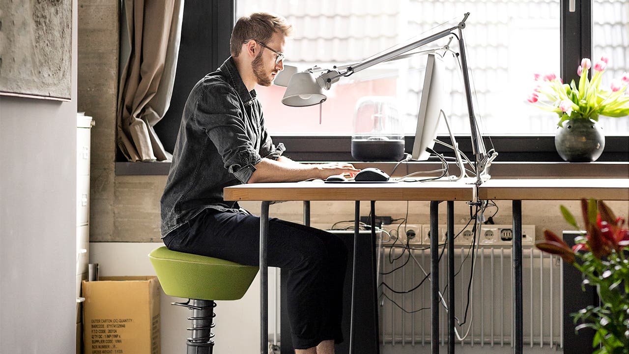 Man typing at desk