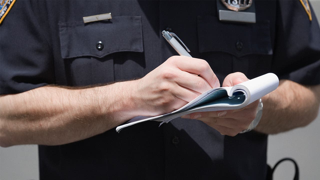 Policeman making notes