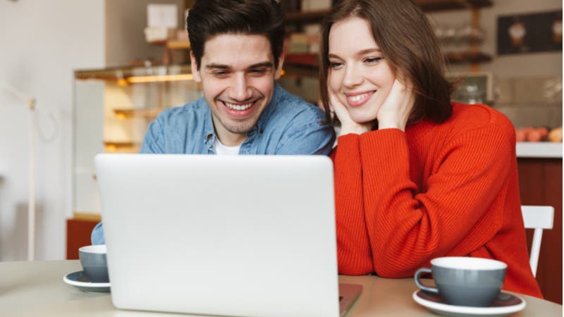 Young couple working together on laptop