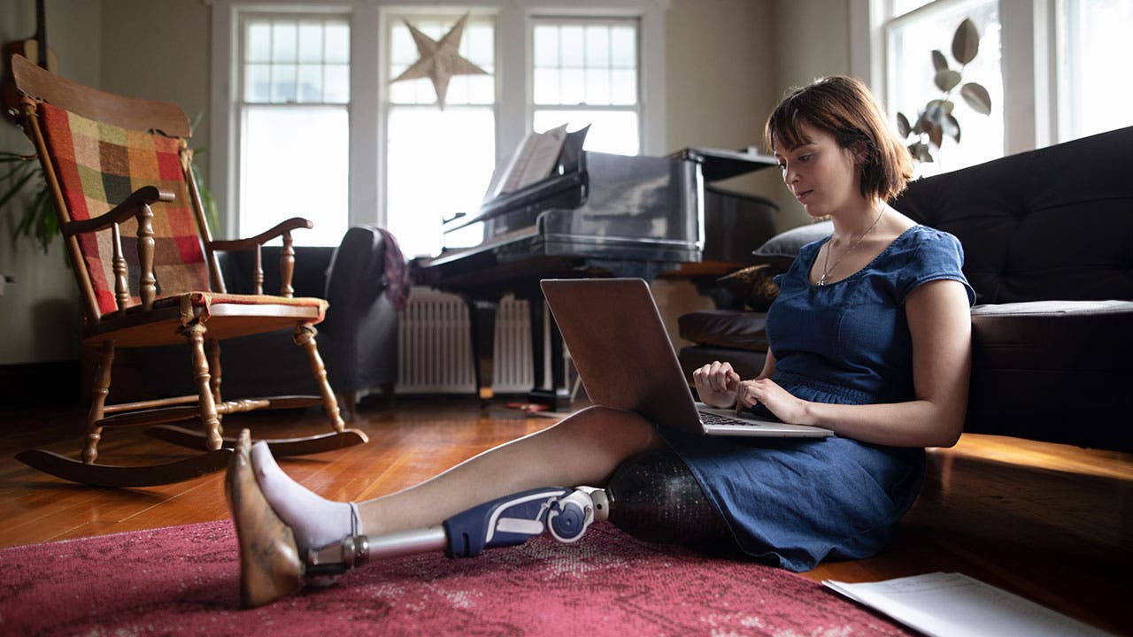 Disabled woman using laptop