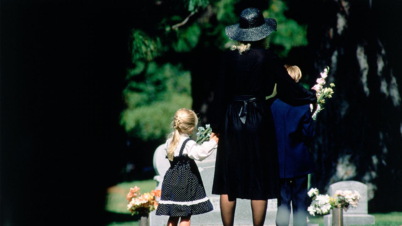 Mourning family at funeral