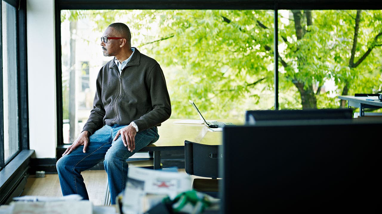 Man looking out of window
